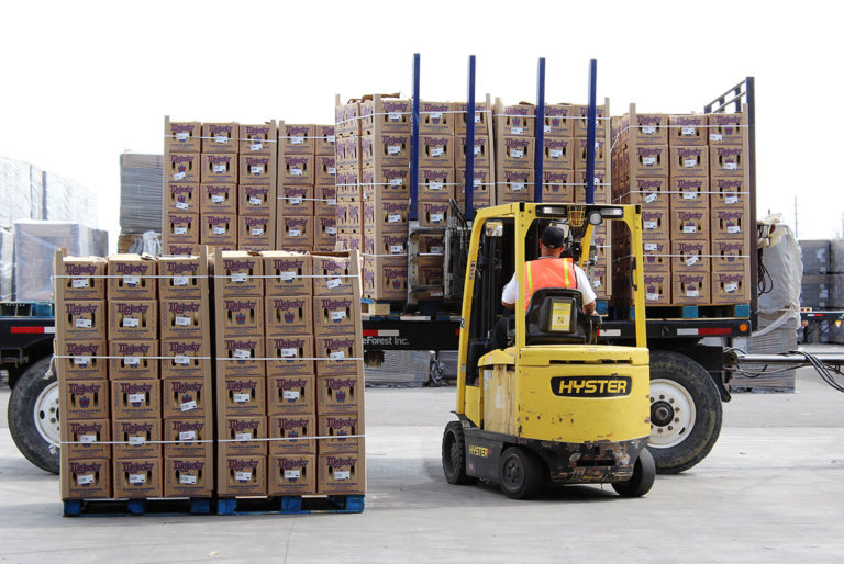 forklift lifitng boxes of cantaloupe